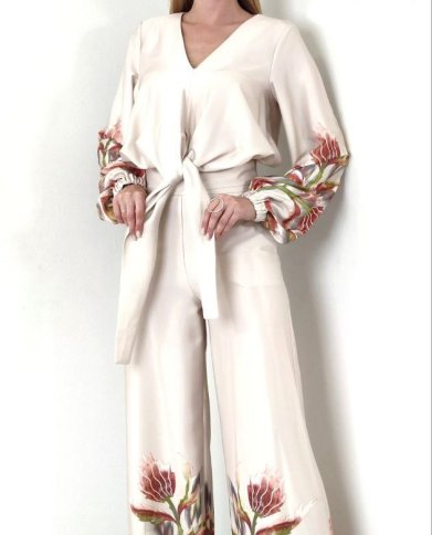 V NECK TIE TOP AND FLARED PANTS WITH FLORAL DESIGN